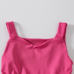 Detailed macro view of the rose pink dance bodysuit showing rib texture and square neckline