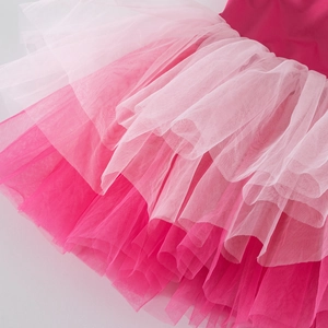 Macro detail of multi-layer gradient pink tulle on a children's ballet tutu skirt