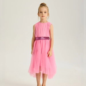 Detailed view of pink girls' tulle dress with a sparkling red sequin waistband