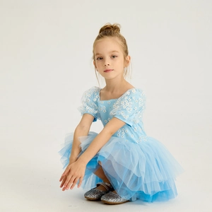 Detail of short sleeve girls ballet dress with white daisy floral print and layered tulle