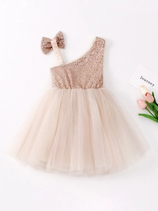 Sleeveless champagne sequin tulle flower girl dress with a large bow for little girls
