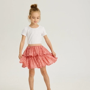Detail of pink sequin tutu skirt for girls with gold elastic waistband and layered design