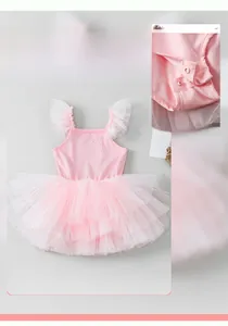 Detail of baby pink ballet tutu with rhinestone accents and snap button crotch closure