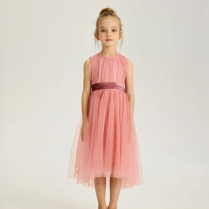 Detail of pink girls' tulle party dress featuring a sparkling sequin waist belt