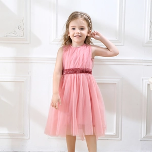 Detailed view of layered pink tulle skirt with sparkling deep red sequin waist belt trim