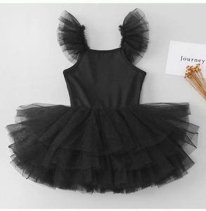 Detail of black girl's ballet tutu with ruffled mesh sleeves and layered tiered cake skirt