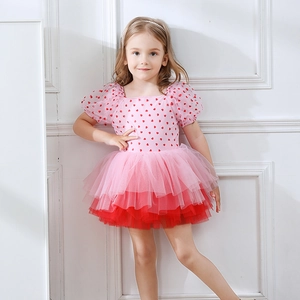 Detail of girls' ballet dress with red heart prints and layered pink tulle tutu skirt