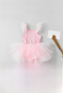 Close-up of pink girls ballet tutu dress featuring glitter rhinestones and mesh ruffles