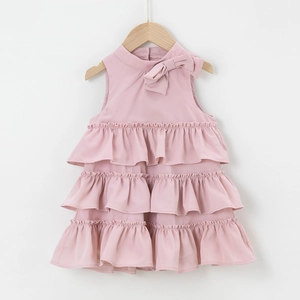 Detail of pink sleeveless tiered dress for girls with elegant bow on the neckline