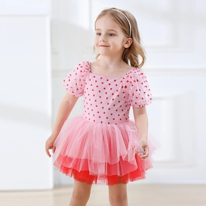 Detail of pink girls ballet dress featuring red heart prints and puffy mesh tutu skirt
