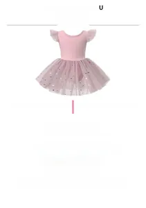 Detail of girls pink ballet tutu with golden star moon prints and flutter sleeves