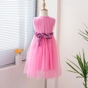 Close-up of pink tulle layered princess dress featuring a sparkly sequin bow on waist