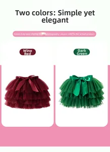 Detail of burgundy and dark green layered tulle tutu skirts with large satin bows