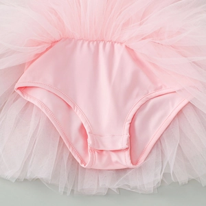 Close-up of pink ballet tutu romper featuring snap button bottom for easy diaper changes