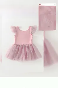 Detail of pink girls ballet tutu with gold star moon prints and rhinestone decorations