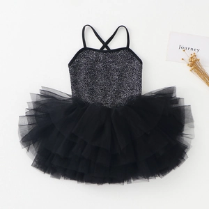Detailed view of girls' black ballet leotard featuring shiny sequins and a layered tulle tutu