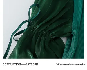 Detail of dark green bubble sleeves with elastic ribbed fabric and silk ribbon ties