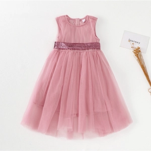 Flat lay of pink girls party dress with sequin belt and layered tulle mesh skirt