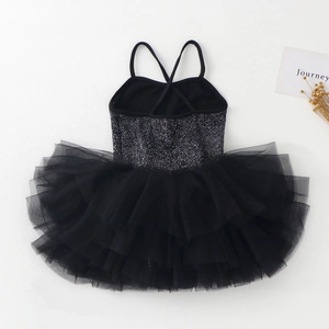Detail of girls' ballet leotard with shimmering silver sequins and black mesh tutu skirt