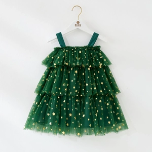 Detail of dark green mesh tutu dress with gold stars and layered ruffles for toddler girls