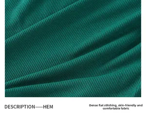 Close-up of dark green ribbed knit fabric featuring high-density flat seams and soft texture