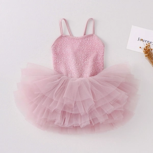 Detail of pink girls ballet leotard featuring sparkling sequins and multilayered tulle tutu skirt