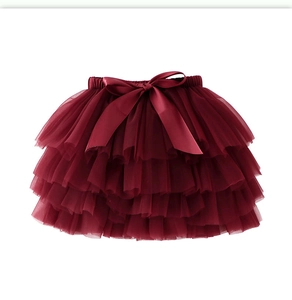 Detail of burgundy multi-layer mesh tutu skirt with large satin bow for girls
