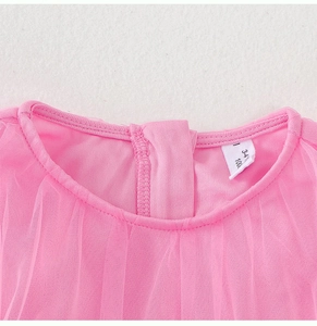 Detailed neckline of pink tulle girls' dress with size tag 100 for 3-4 years old