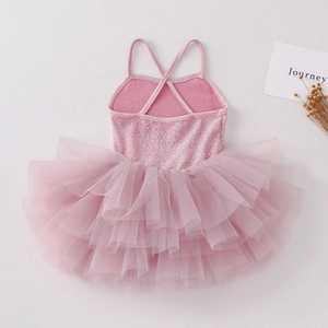 Detail of pink girls' ballet leotard showing sequined bodice and cross straps on back
