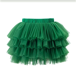 Close-up of dark green layered tulle tutu skirt with elastic waistband for girls