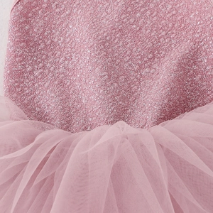 Detail of pink sequins and multilayered soft mesh tulle on girls ballet dance leotard