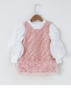 Detail of pink textured pinafore dress and white lantern sleeve blouse set for girls