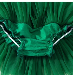 Detail view of toddler green tutu skirt featuring integrated bloomers and layered soft mesh