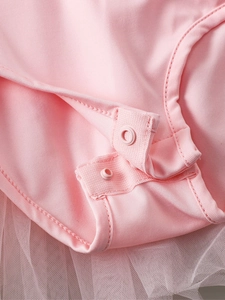 Pink girl's dance leotard with rhinestone details and soft mesh tutu skirt overlay