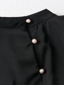 Girl's black autumn cake dress with elegant pearl buttons and gold lace bases