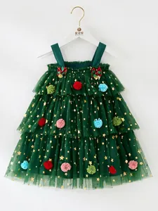 Green Christmas tutu dress for toddler girls featuring gold stars and colorful pom-poms