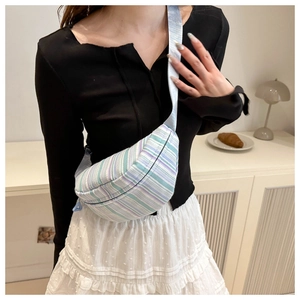 Detail showing striped fabric texture and adjustable strap of the casual crossbody chest bag