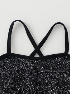 Girls ballet leotard with black sequin fabric and crisscross strap detail on white background