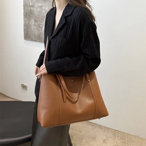 Brown leather tote bag for women with large capacity and elegant shoulder straps