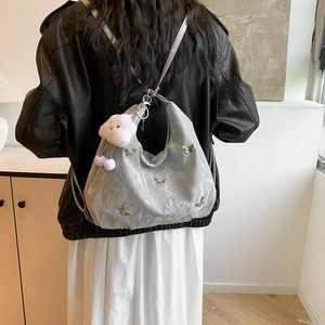 Light gray hobo shoulder bag with silver butterflies and cloud plush charm detail
