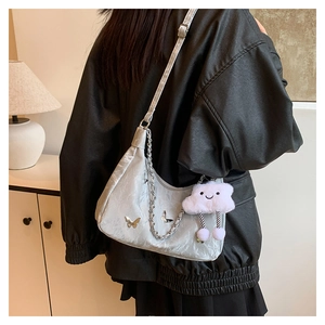 Silver metallic butterfly shoulder bag with chunky chain and plush cloud charm detail