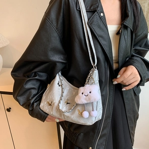 Silver crescent hobo bag with butterfly hardware, metal chain and plush cloud charm
