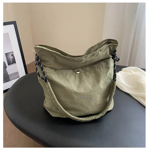 Sage green pleated nylon shoulder bag with wide elastic strap and silver button detail