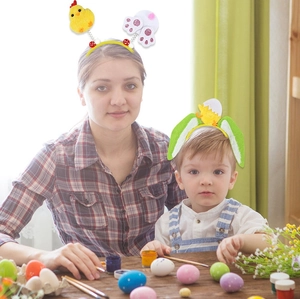 Close-up of Easter headbands featuring yellow chicks and rabbit ears for party decor