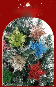 Macro detail of glittered double-layer artificial poinsettia flowers on a snowy Christmas tree
