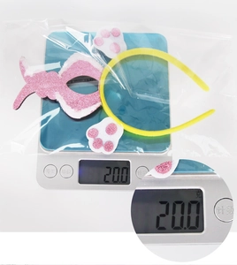 Weight measurement showing 20g for the yellow Easter chick headband set in packaging