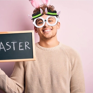 Easter party glasses with bunny ears and top hat design on a festive model view