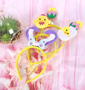 Detailed view of Easter headbands featuring yellow plush chicks and rabbit ears designs