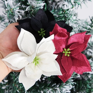 Detail of 12cm velvet artificial poinsettia flowers with realistic petals and stamens