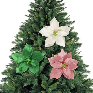 Close-up of velvet poinsettia flowers in white, green, and pink for Christmas tree decor